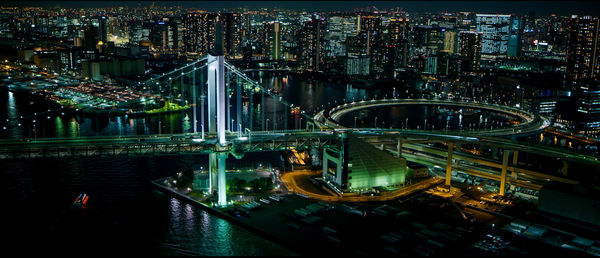 High angle view of illuminated bridge over river at night