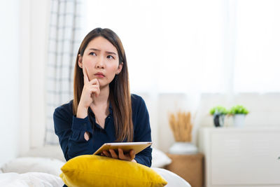 Young woman using smart phone