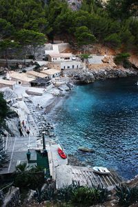 High angle view of townscape by sea