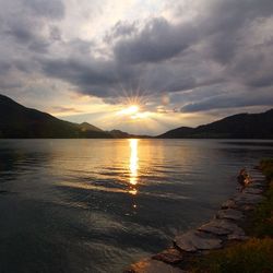 Scenic view of lake at sunset