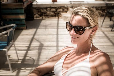 Portrait of young woman wearing sunglasses