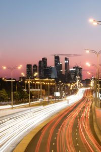 High angle view of light trails on road at night