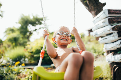 Smiling young woman sitting outdoors