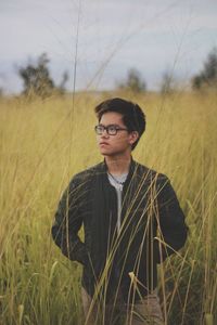 Beautiful young man in field