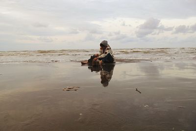 Woman standing on beach