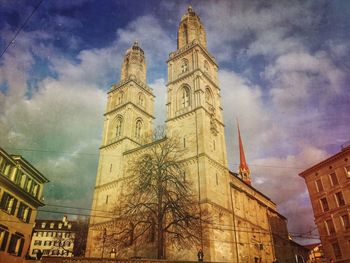 Low angle view of building against cloudy sky