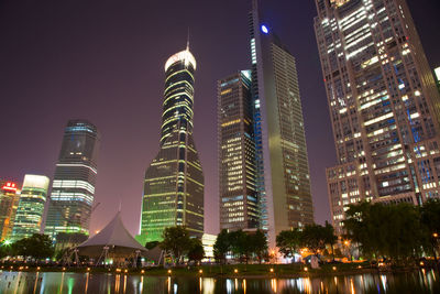 Illuminated buildings in city at night