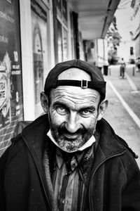 Portrait of man wearing mask in city street