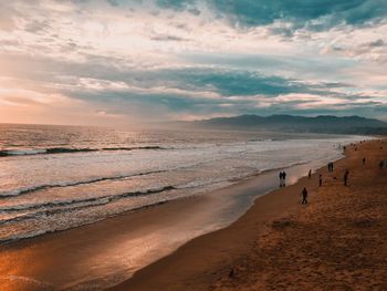 Scenic view of beach against sky during sunset