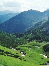 Scenic view of landscape and mountains against sky