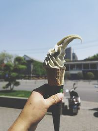 Midsection of person holding ice cream