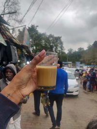 Midsection of man drinking glass