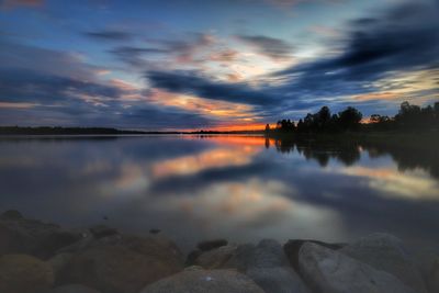 Scenic view of lake against sky during sunset