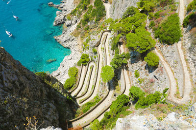 High angle view of rocks on sea