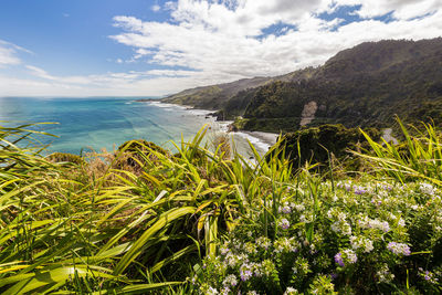 Scenic view of sea and rocks against sky