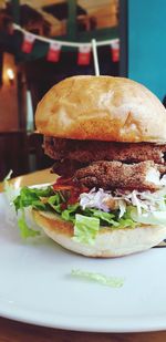 Close-up of burger in plate on table