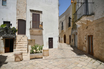 A small street in casamassima, a village with blue-colored houses in the puglia region of italy.