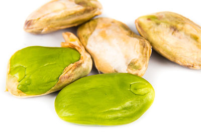 Close-up of bananas in plate against white background