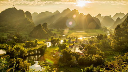 Scenic view of landscape against sky during sunset