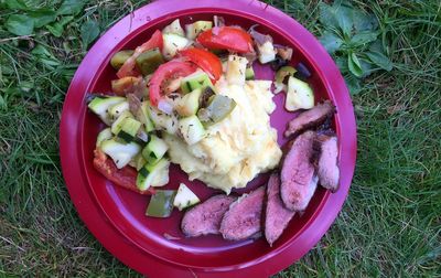 Directly above shot of salad in bowl on field