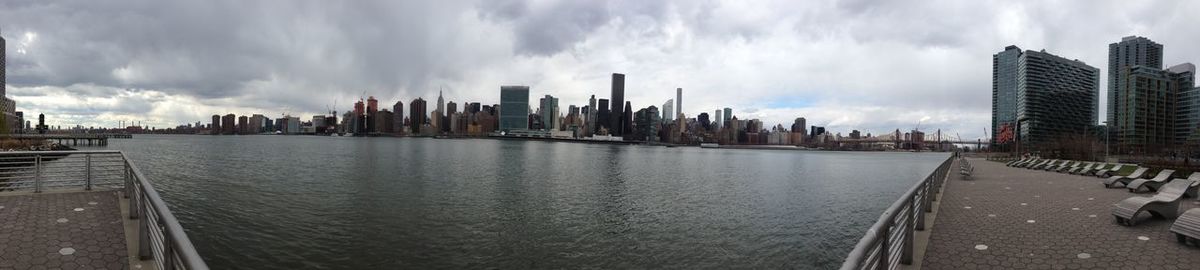 City skyline against cloudy sky