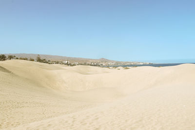 Scenic view of desert against clear sky