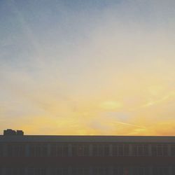 Built structure against sky at sunset