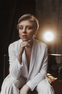 Young stylish woman businesswoman in white suit