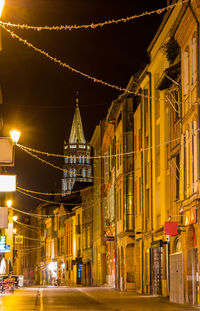 Illuminated buildings in city at night