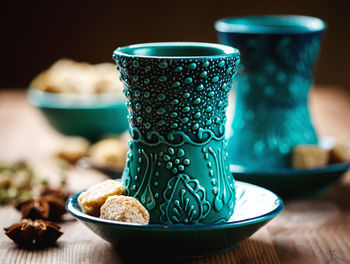 Close-up of coffee cup on table