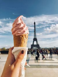 Cropped image of hand holding ice cream