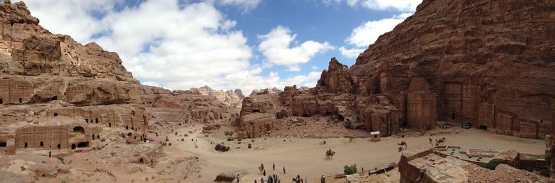 Panoramic view of people against sky