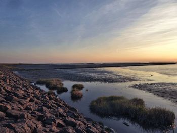 Scenic view of sea against sky during sunset