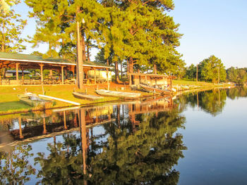 Scenic view of swimming pool by lake against sky