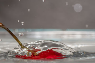 Close-up of water splashing in glass