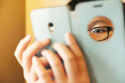 Close-up of teenage boy using phone