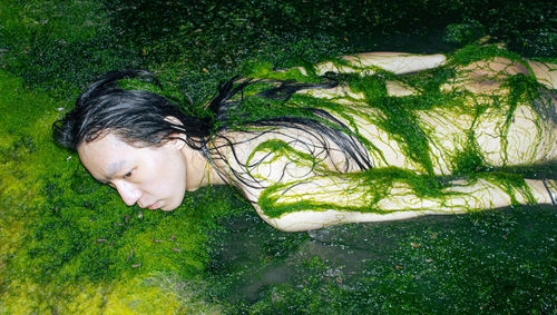 High angle view of young woman in water