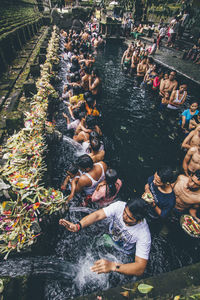 High angle view of people enjoying in water