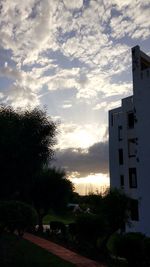 Low angle view of building against sky during sunset