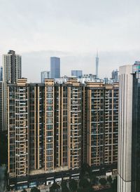 Modern buildings in city against sky