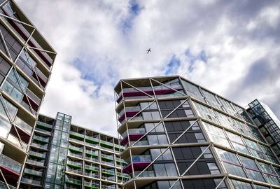 Low angle view of building against cloudy sky