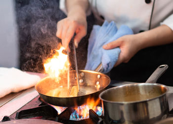 Midsection of man preparing food