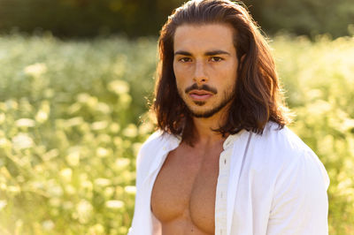 Portrait of young man standing outdoors