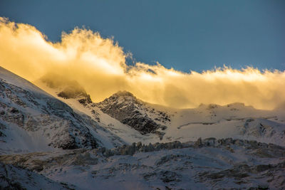 Scenic view of mountains against sky during winter