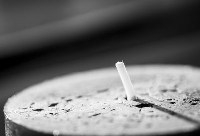 Close-up of a candle on table