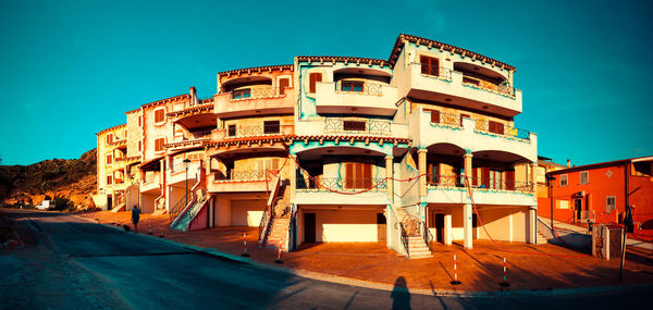 Buildings against blue sky and clouds