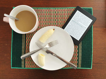 High angle view of coffee cup on table