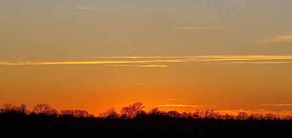 Scenic view of silhouette landscape against romantic sky at sunset