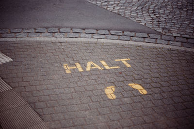 High angle view of text written on road