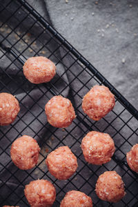 High angle view of orange fruits on metal grate